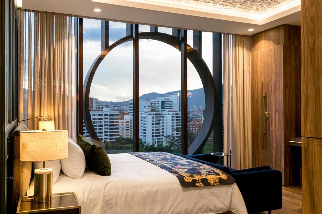 Hotel Marquee Medellin Bagian luar foto A bedroom at the hotel